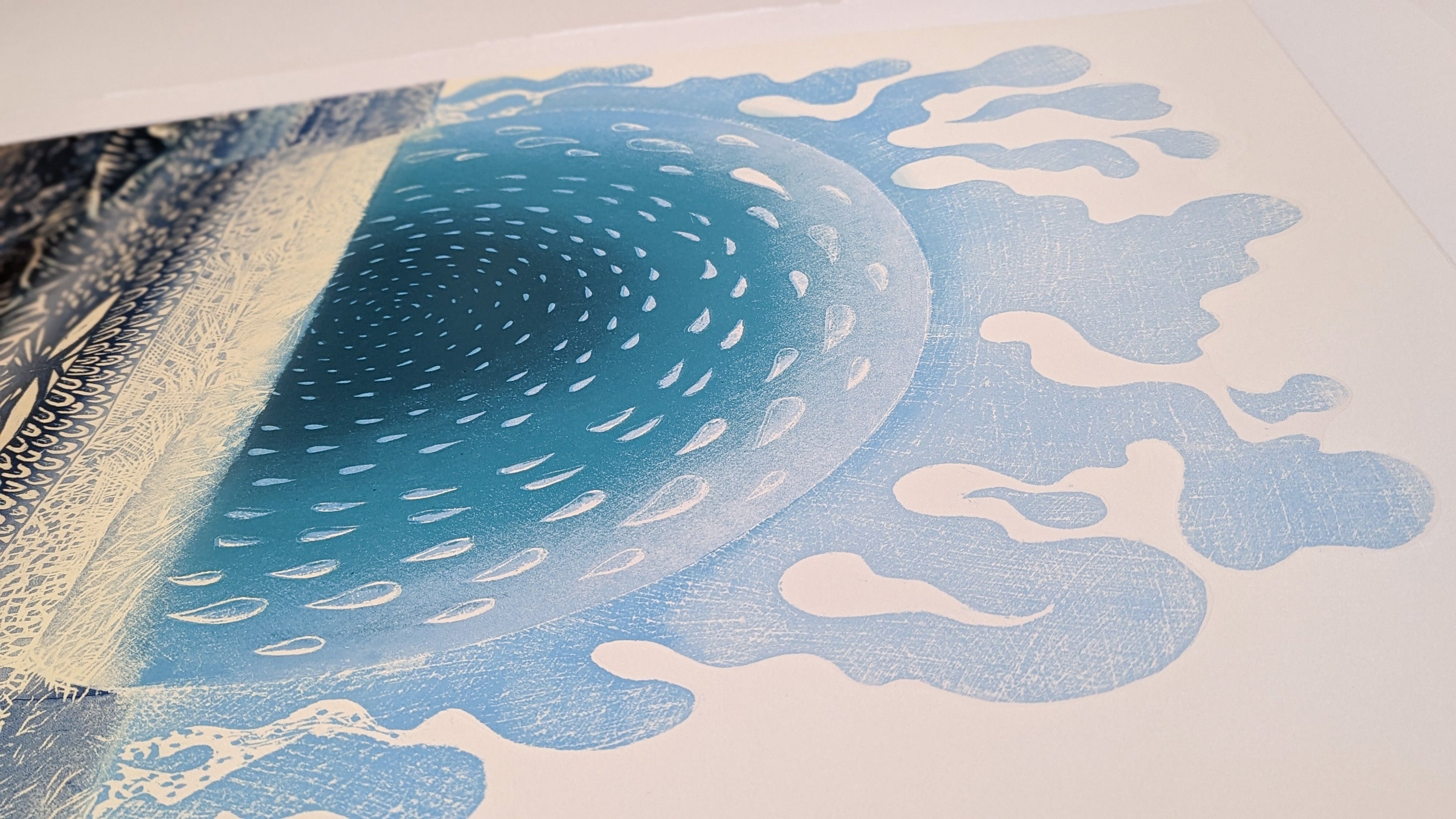 Abstract art piece with blue and white patterns on a textured background